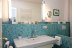 'Neues Bad im Erdgescho mit trkisfarbenen Mosaikfliesen,  groem Waschtisch...'